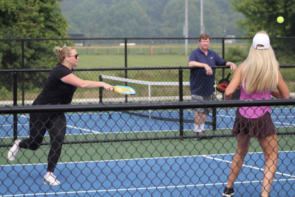 “Picklers” or “Pickleballers” try out the new courts.