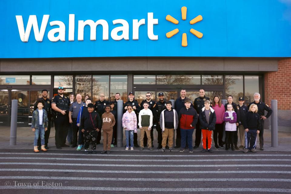 Members of Easton Police Department, Oxford Police Department, and Talbot County Sheriff&#039;s Office stand alongside their &#039;Shop with a Cop&#039; companions at Walmart on Elliot Rd. in Easton.