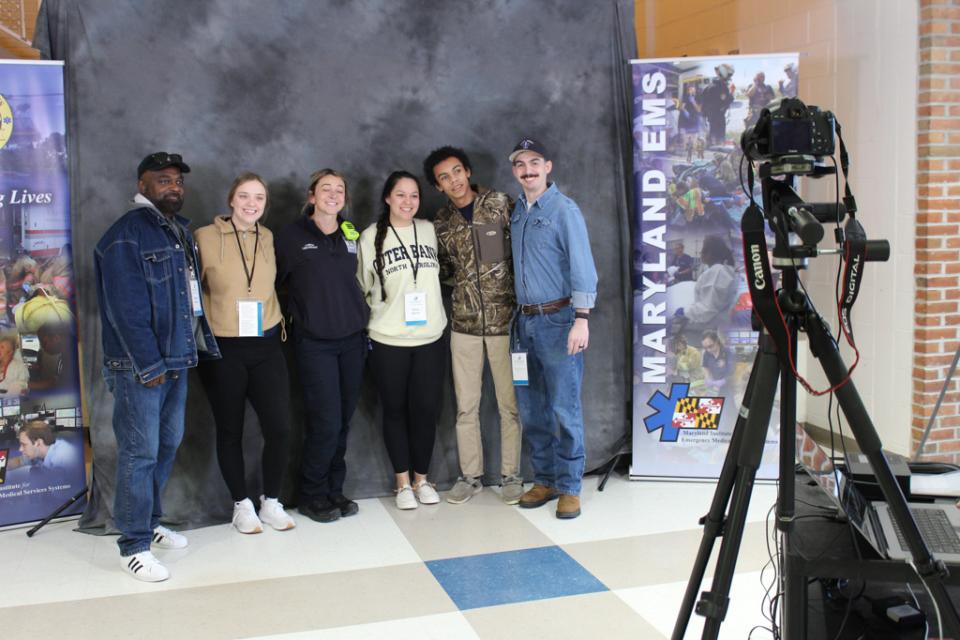 Talbot County Department of Emergency Services staff joins apprentice Giovanni Greaves (second from right) for a photo shoot with Maryland EMS.