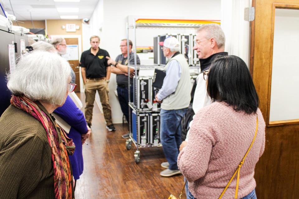 Staff explains to the County Council, State Legislators, and other tour guests how the voting process works and what equipment is used.