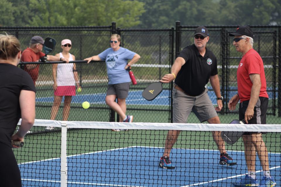 Talbot County Parks and Recreation Director Preston Peper scores on a backhand shot with teammate and USE Pickleball Association District Ambassador for the Maryland Eastern Shore, Nick Papson.