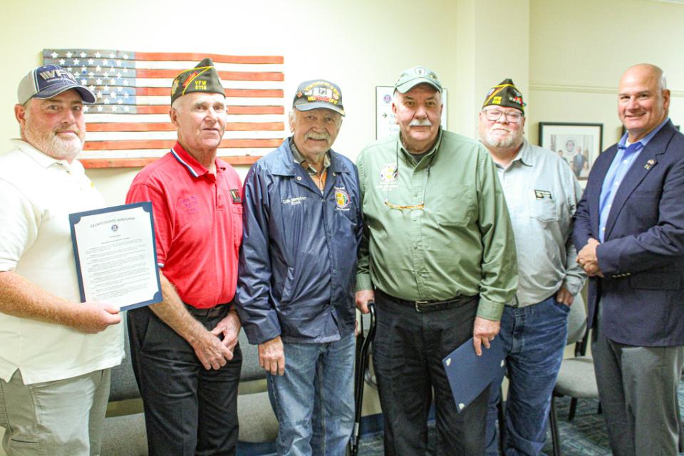 Members of VFW Post 5118 pose with proclamation.